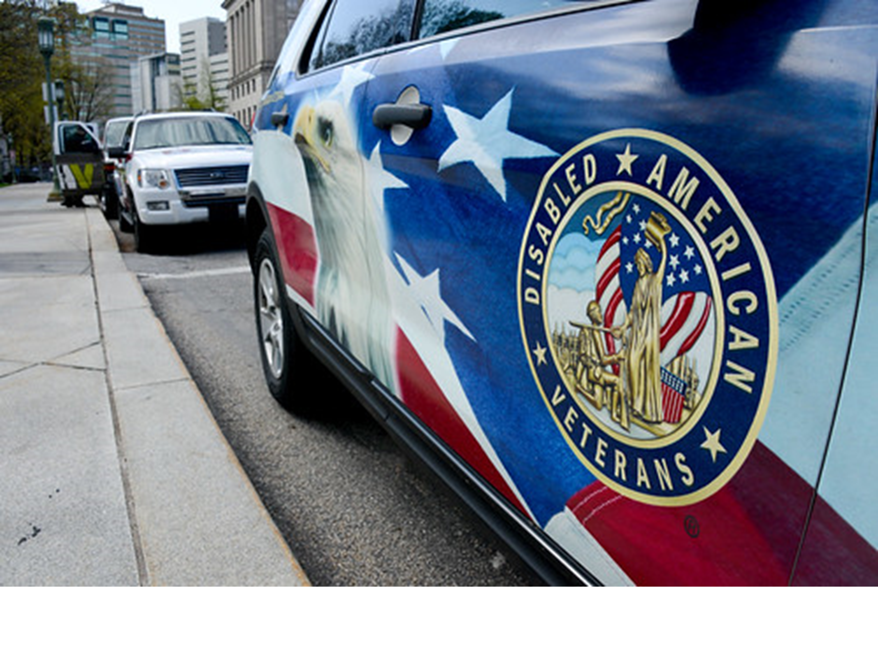 Photo of side of vehicle with Disabled American Veterans logo on side.