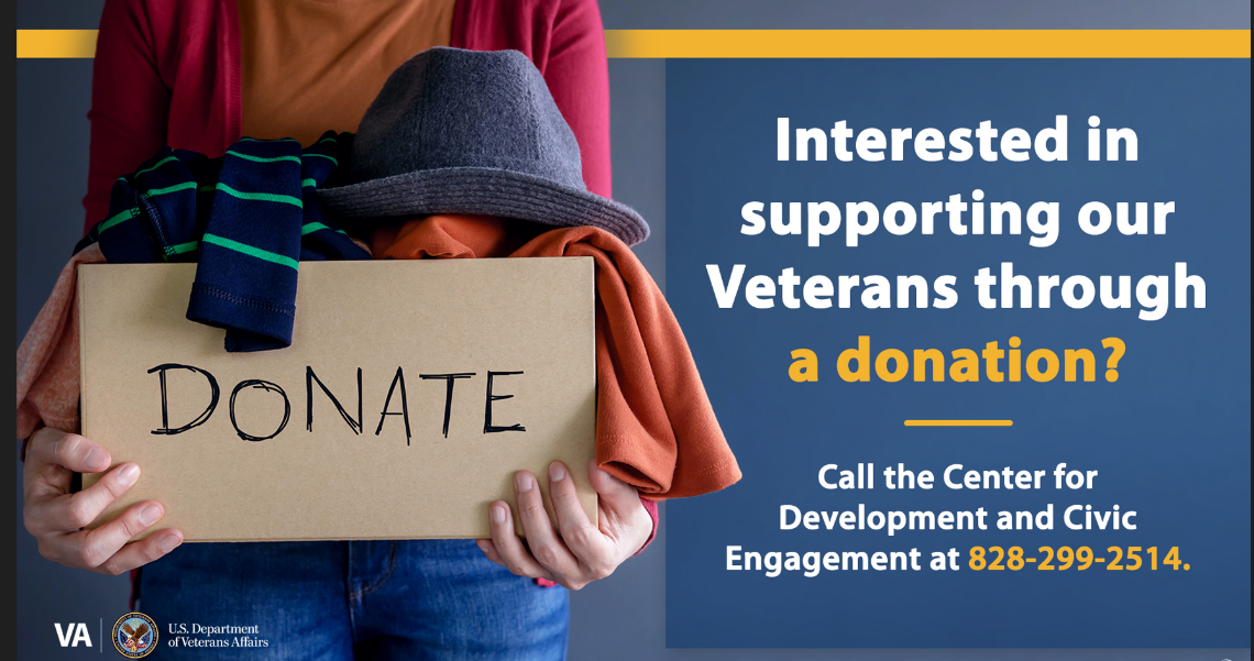 A woman holding a box of clothing with the word donate on it. Interested in supporting our Veterans through a donation? Call the CDCE at 828-299-2514.