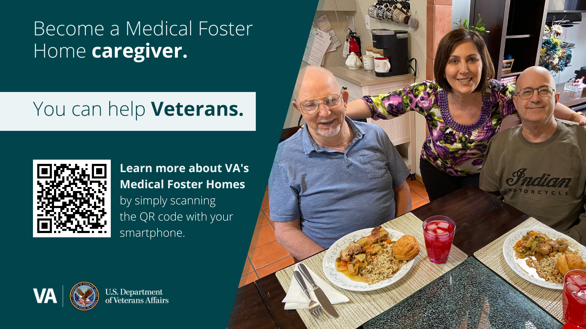 Two elderly male Veterans seated at a dining table with plates of food, and a female caregiver standing between them.