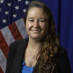 Angela Bodnar in front of US Flag