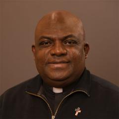 Smiling Chief of Chaplain Service.