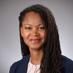 Woman in front of grey background