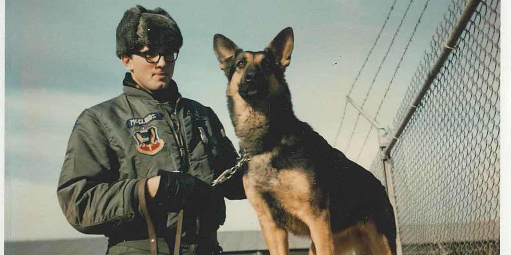 Vietnam era soldier and dog.