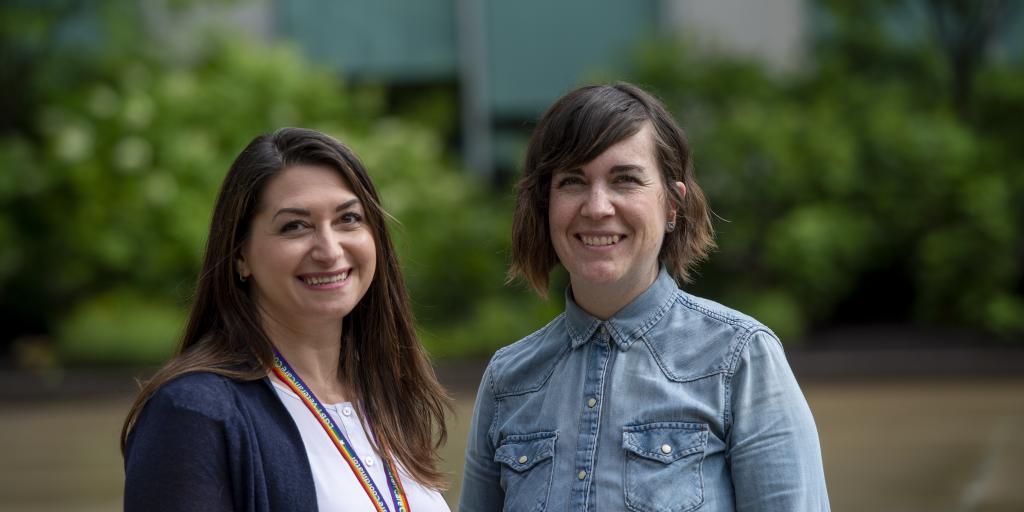Two women standing next to each other.
