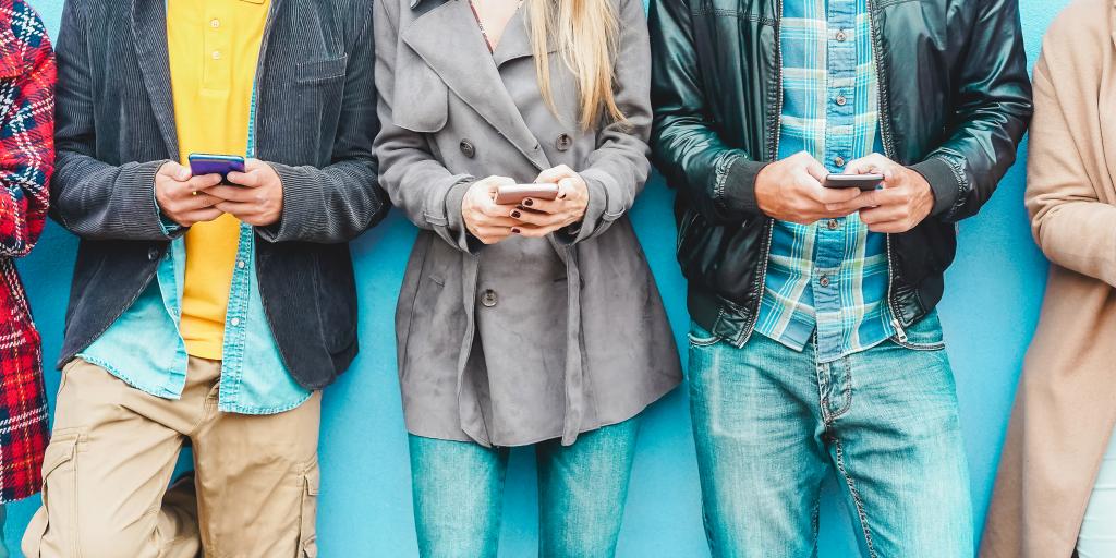 Diverse people using cell phones
