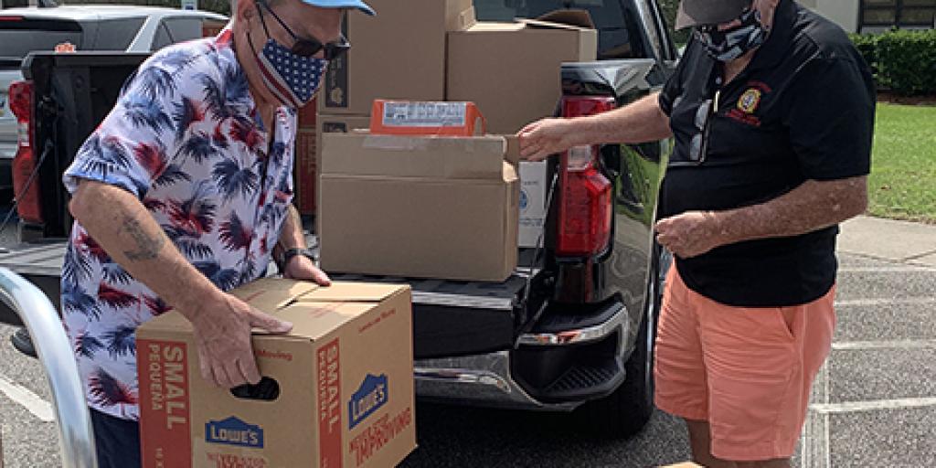 VFW Post 10804 and Country Lakes unloads a donation of more than 1,000 pounds of shelf-stable food for the Curbside Delivery Program for Veterans in Myrtle Beach, South Carolina. 