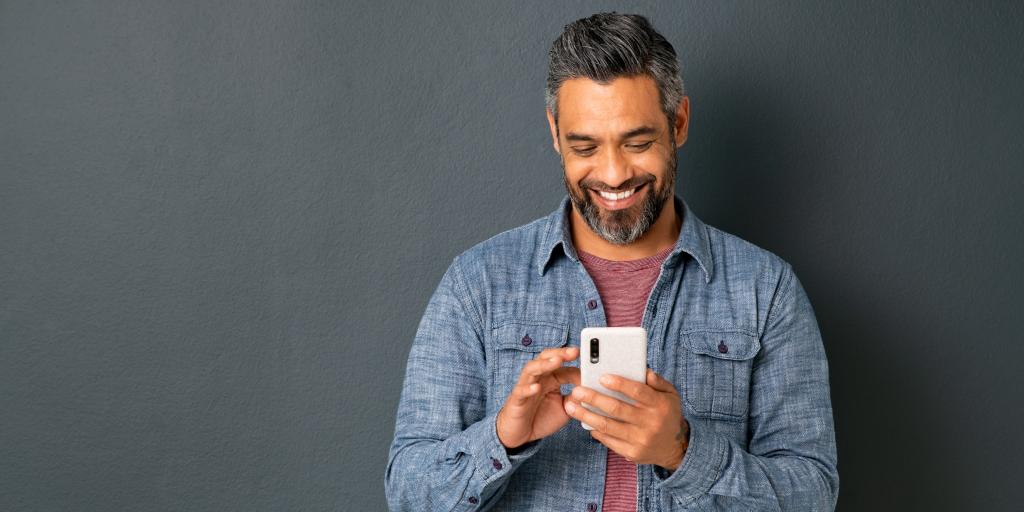 VISN 2 VA Health Connect stock photo (man holding a cell phone)