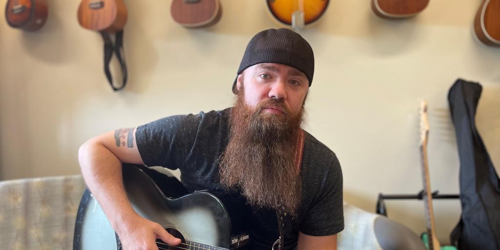 Veteran Sean Young with his guitar collection.