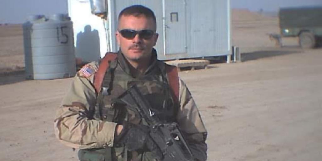 Army Veteran Michael "Todd" Sims standing in Iraq at his base. He served from 2001 to 2006 and deployed to Iraq in 2004.