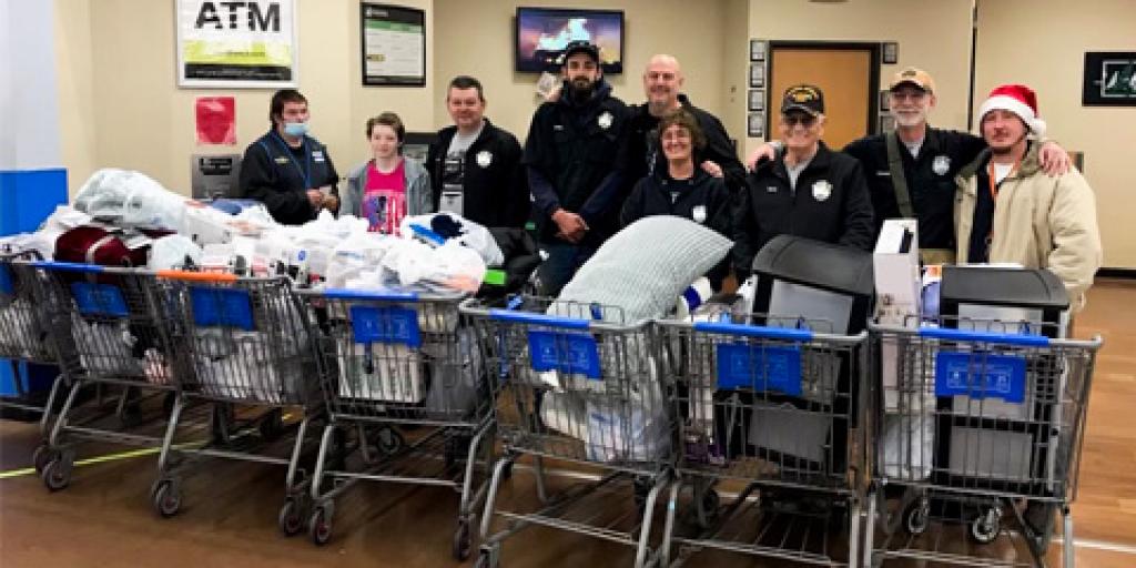 Members from the Get Wet for a Vet organization standing behind shopping carts.