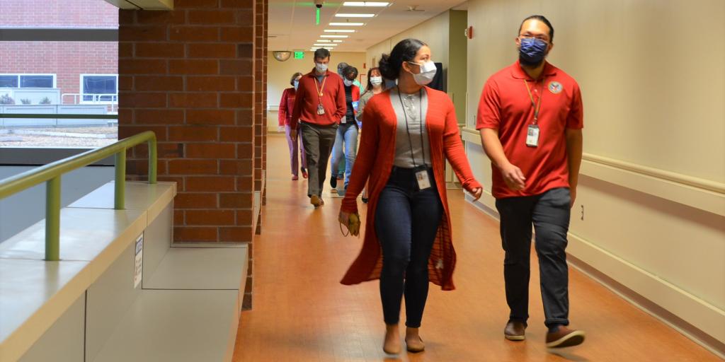 VA staff walking down hallway