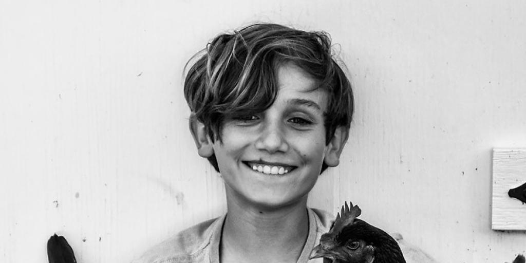 boy with chickens