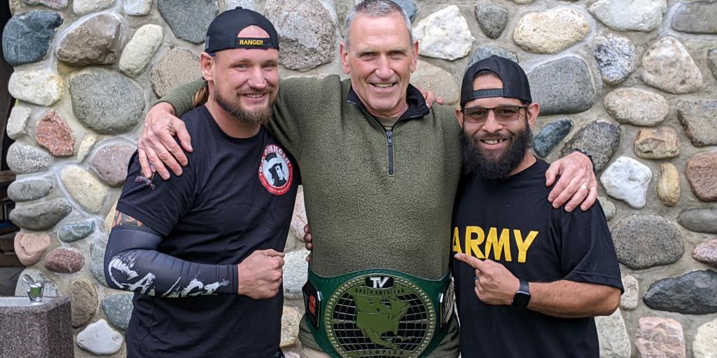 Veterans Ben Evenson, left, and Sam Lovdahl pose with Milwaukee VA psychiatrist Dr. Michael McBride