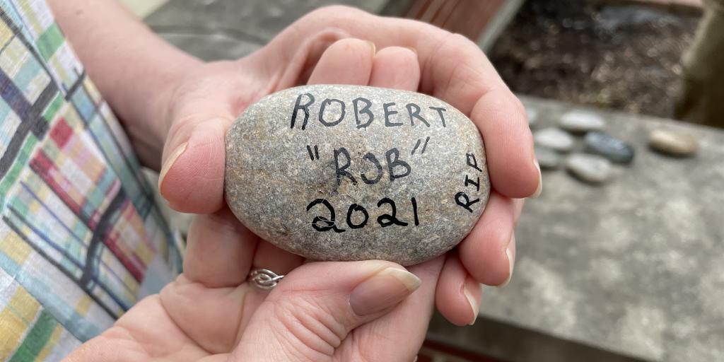 Judy Sheridan holds a memorial stone for her husband Robert Sheridan, a Vietnam Veteran who passed away in 2020. Sheridan's stone was one of dozens of stones laid in dedication to Edward Hines, Jr. Veterans Hospital's new Memorial Stone Garden located near the Winter Garden
