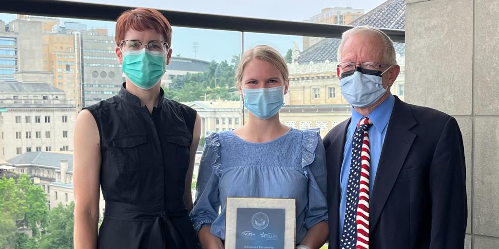 Emily Boltey received her Gold Award. (from left to right): Jamie L. Estock, Emily Boltey, Dr. David E. Eibling