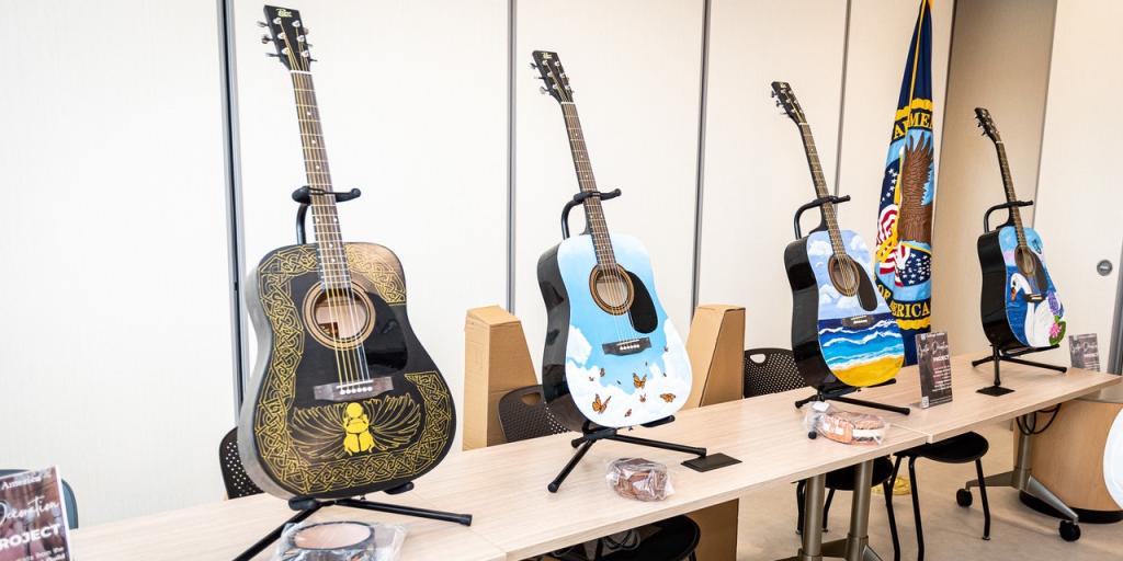 Display of hand-painted guitars