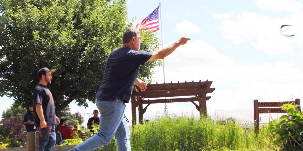 Veterans gather outside and play horseshoes at White River Junction VA Medical Center in Vermont