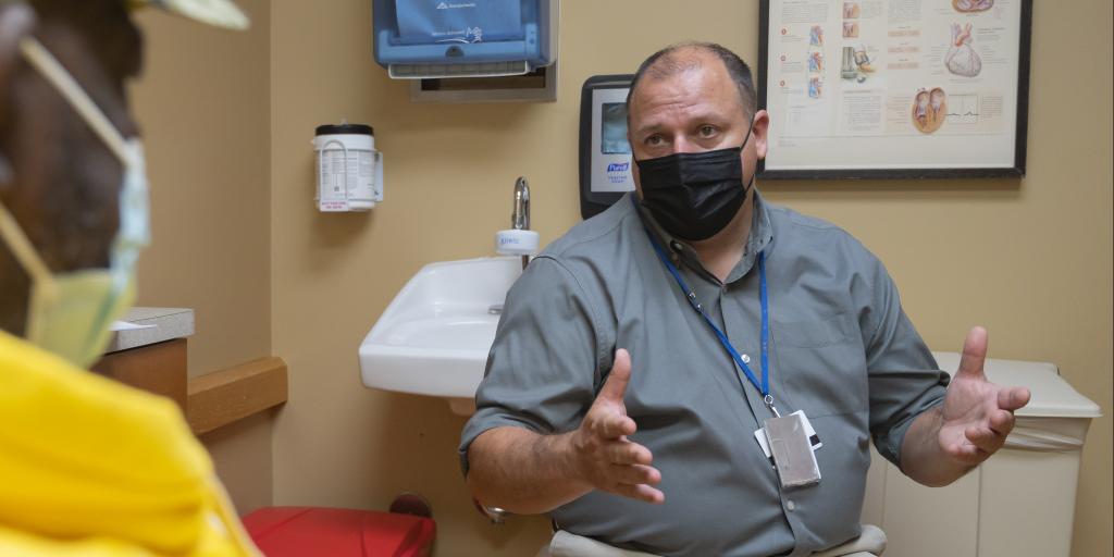 Dr. Reynold Lopez-Soler consults with a Veteran about kidney transplant options at Edward Hines, Jr. VA Hospital on Aug. 11, 2022. Lopez-Soler is the Director of Hines VA's Renal Transplant Program.