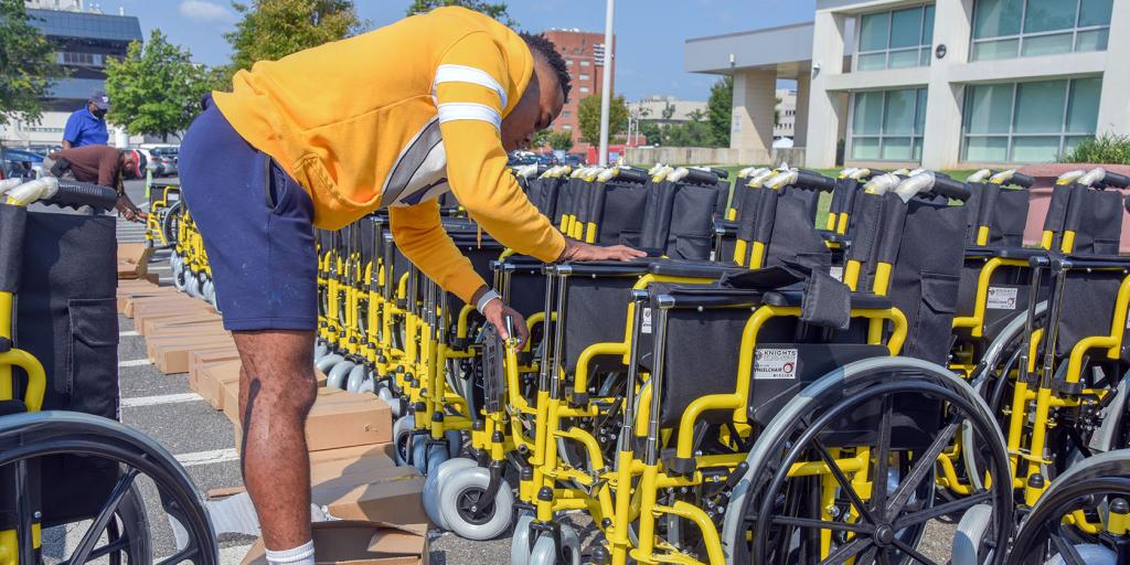 Members of the DC Knights of Columbus helped to set up wheelchairs they donated to the Washington DC VA Medical Center on Sept. 15, 2022.