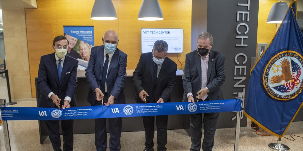 VA Pittsburgh Healthcare System Medicine Service Line Vice President Dr. Patrick Strollo, left, Chief of Staff Dr. Ali Sonel, Connected Care Manager Ed Briones, and Executive Director Donald Koenig prepare to cut the ribbon at the Vet Tech Support Center on Sept. 22.