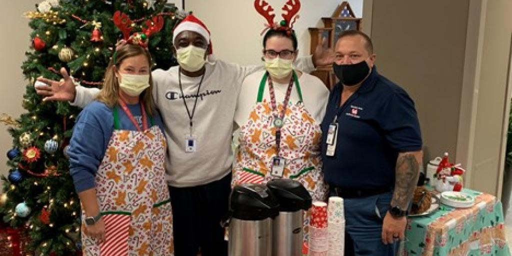 Pictured from left to right are Kimberly J. Gladson, a recreation therapist at JHQVAMC, Michael Goode, a Veteran and patient at the JHQVAMC domiciliary, Menley S. Creekmore, a recreation therapist at JHQVAMC, and Mike Kromoff, chief of Voluntary Services at JHQVAMC.