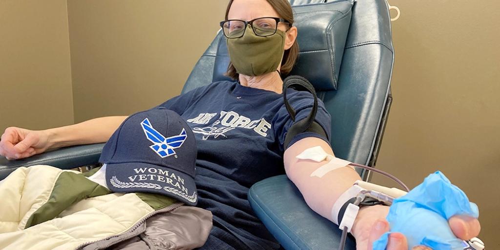 Female Veteran donating blood in a VA Medical Center.