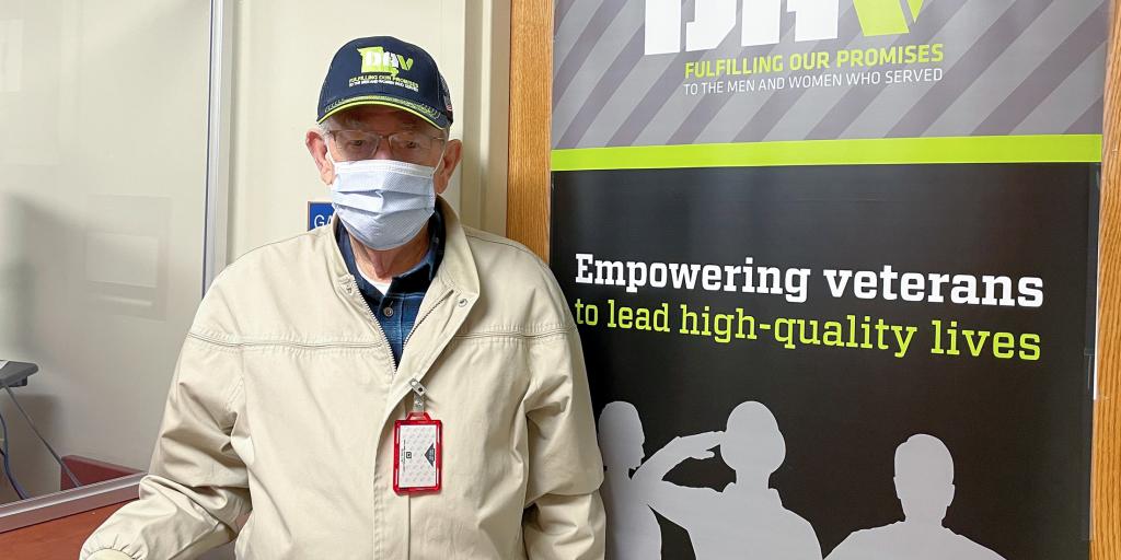 Larry Cochran stands inside the DAV office