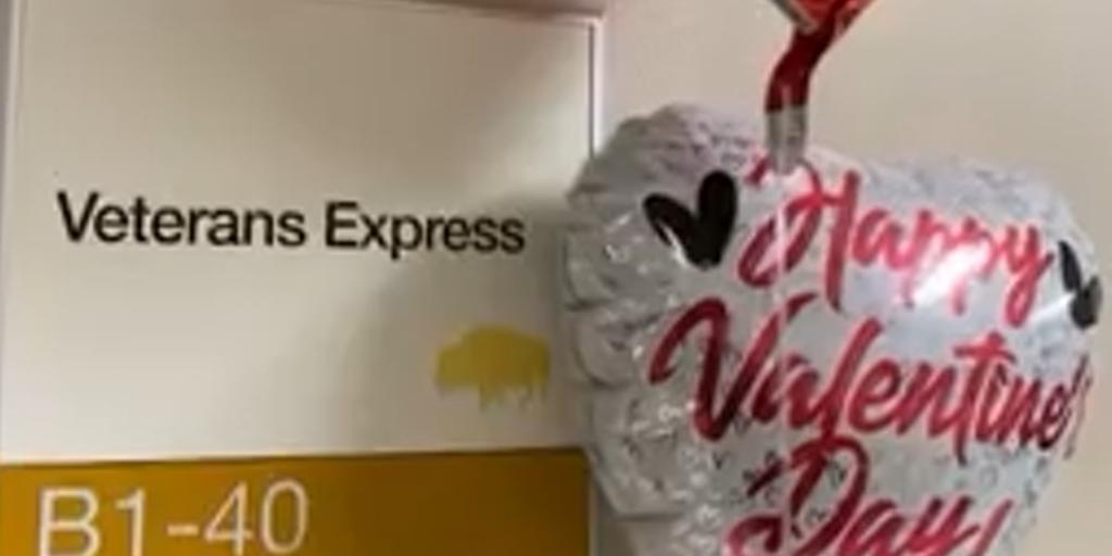 Veterans Express room sign next to Valentine balloons.