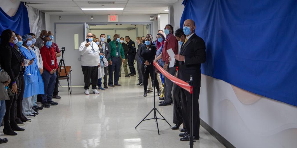employee recognition wall ribbon cutting ceremony
