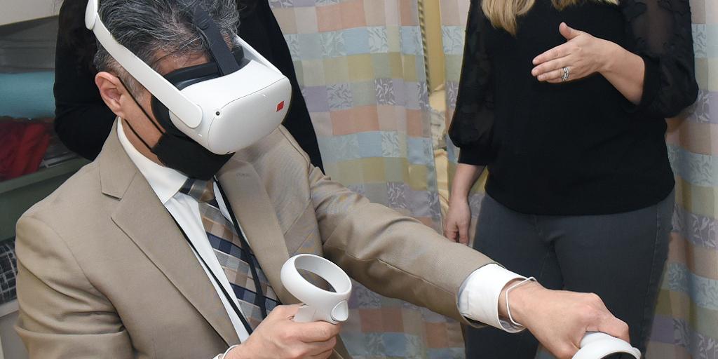 John J. Melton, executive director of the Salisbury VA Health Care System, motions with a controller during  a "Moments That Matter" VR pilot program session at the W.G. (Bill) Hefner Medical Center in Salisbury, North Carolina.