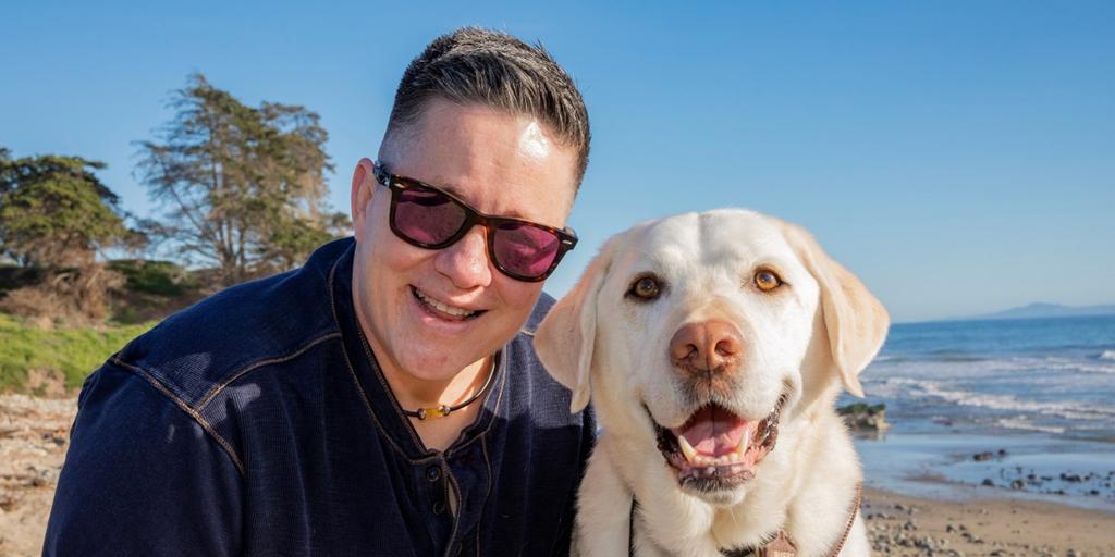 Cheri Owen with her guide dog Martinez. With Martinez in her world, he adds additional confidence to her mobility. Her guide dog is so special to her because he is an amazing worker and an unconditional friend.