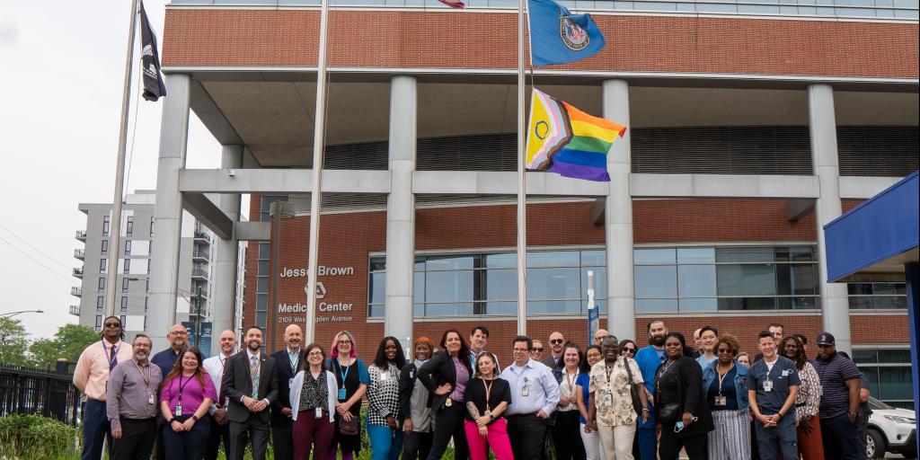 va employees with pride flag