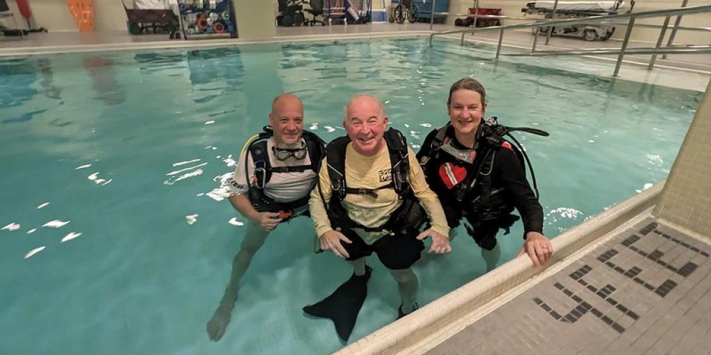 Steve Rivera in pool with Doug Mazur and TIna Stoeckmann