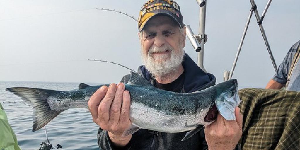Veteran holding fish