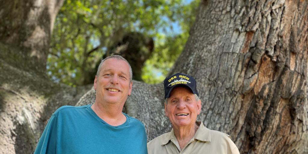 Rudolph 'Hoot' Gibson stands with his son, Zane Stokes, after they were reunited using 23andMe DNA test results.