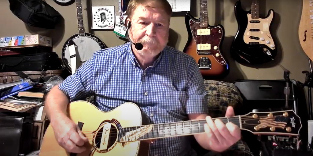 Veteran playing a guitar