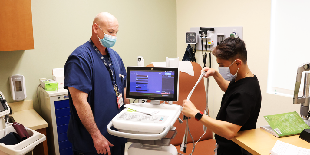 Two nurses prepare equipment.