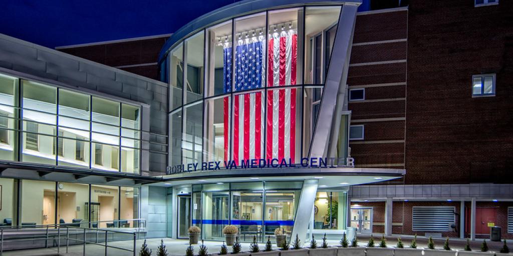 Night image of the West Entrance of the Louisville VA Medical Center