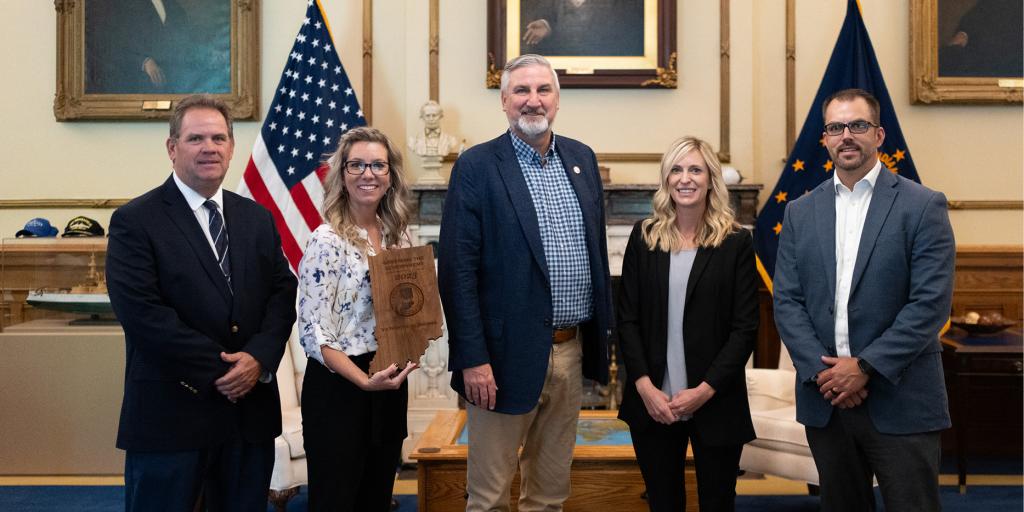 VA Northern Indiana employees posing with Indiana Governor, Eric Holcomb.
