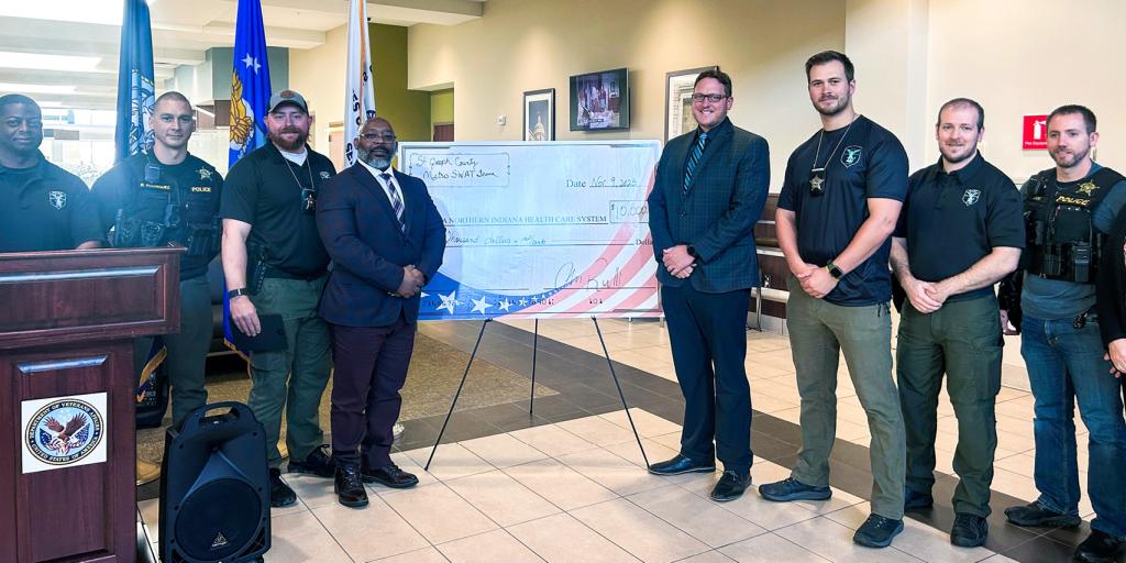 Jackie Walorski VA Clinic accepting a large donation from the Memorial Day Murph Fundraiser