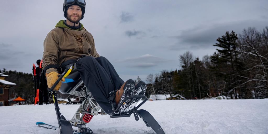 Colton Carlson, Marine Veteran at Mount Sunapee for the 2024 36th Annual New England Winter Sports Clinic on his sit-ski.