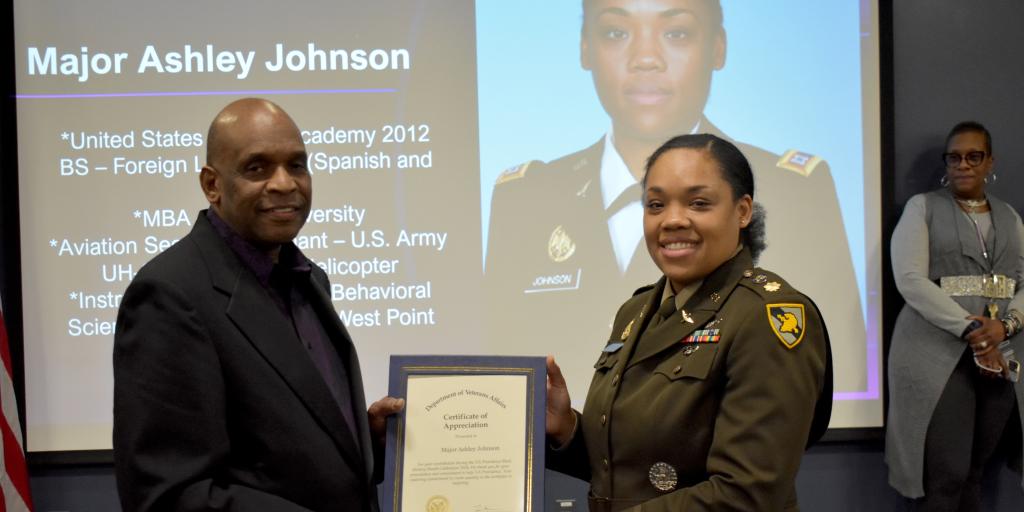 Michael Norde (Left) gives Major Ashley Johnson (Right) a VA Providence Certificate of Appreciation.
