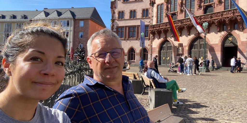 Alexandra Gillen and her father sit in front of a building in Frankfurt, Germany.
