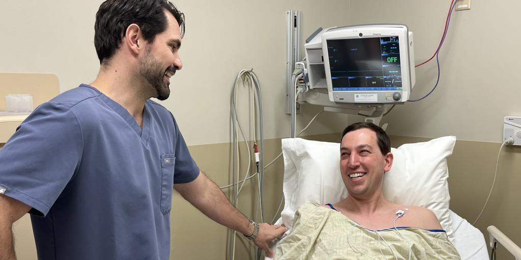 Doctor chatting with patient prior to colonoscopy