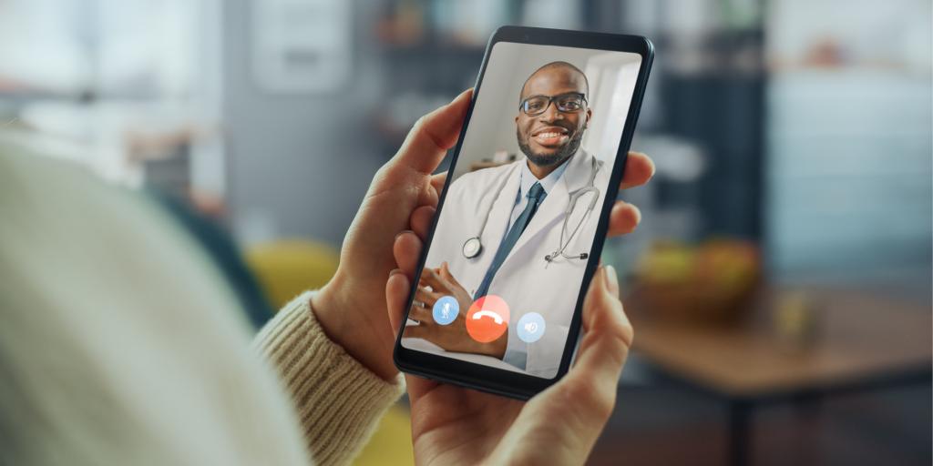 Woman speaking with her healthcare provider over video chat on her mobile phone.