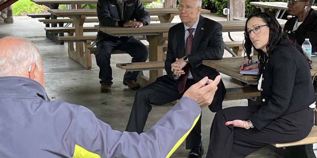 VA official listening to a Veteran.