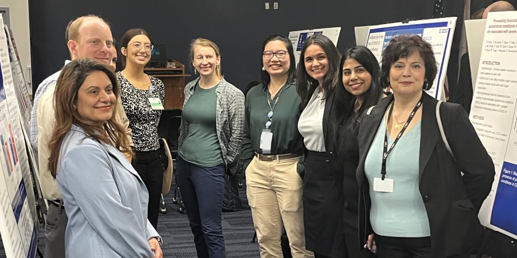 VA Providence Researchers pose with their posters during Research Day.