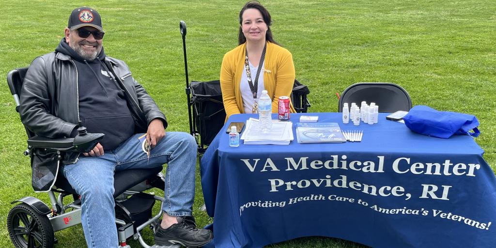 Trisha Cote, VA Providence Enrollment Supervisor, meets with a local Veteran at the Veteran Expo.