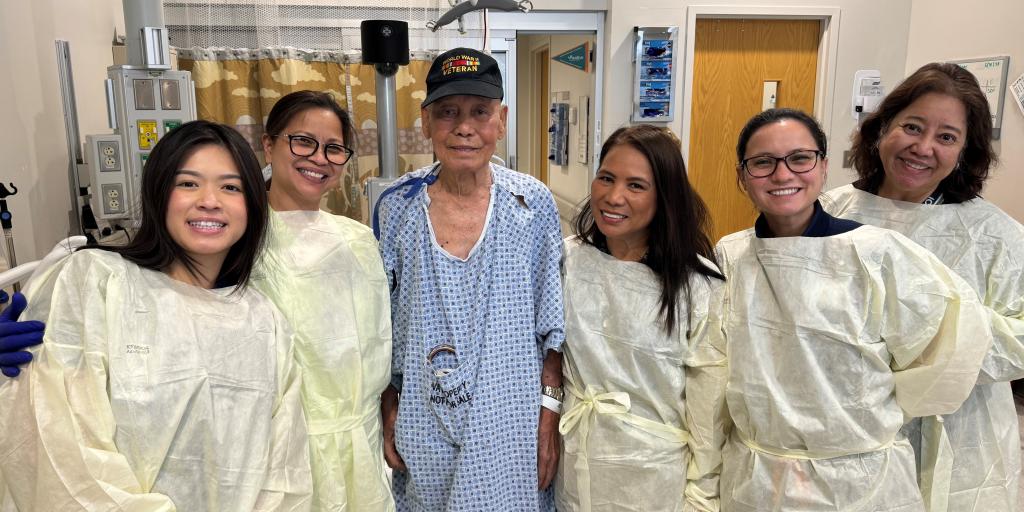 Maximino Vasquez, WWII Veteran with Jovita Fisher, RN in the Inpatient Ward and 5 other nurses in the Emergency Department.