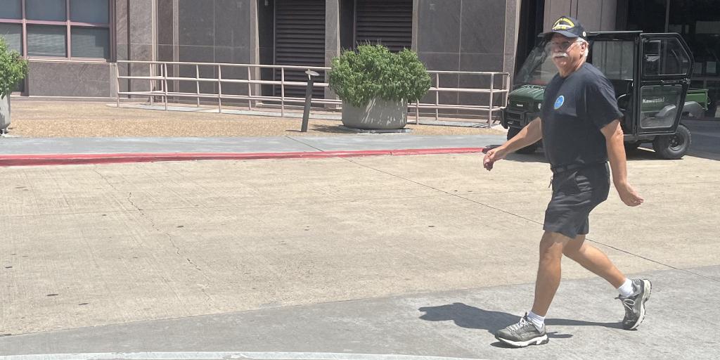 Navy Veteran John Kash goes for a walk outdoors.